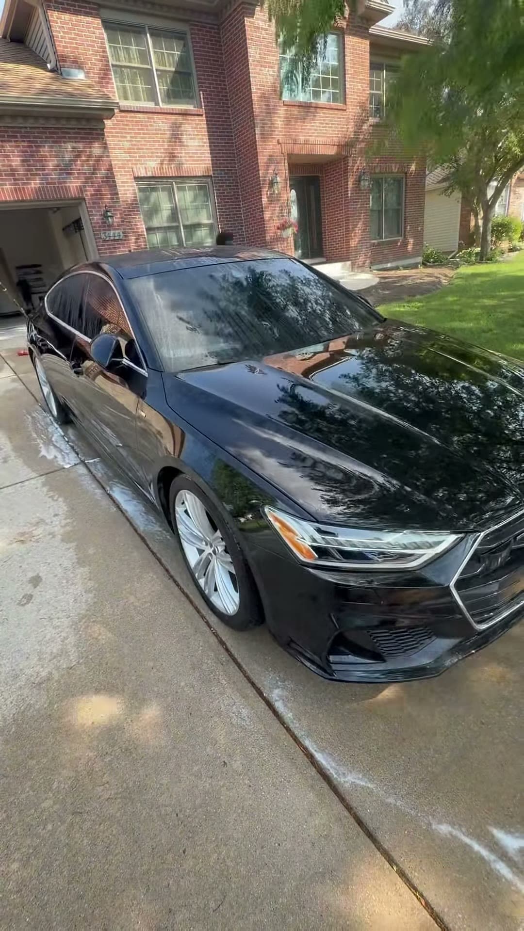 Black Audi exterior during the rinse stage