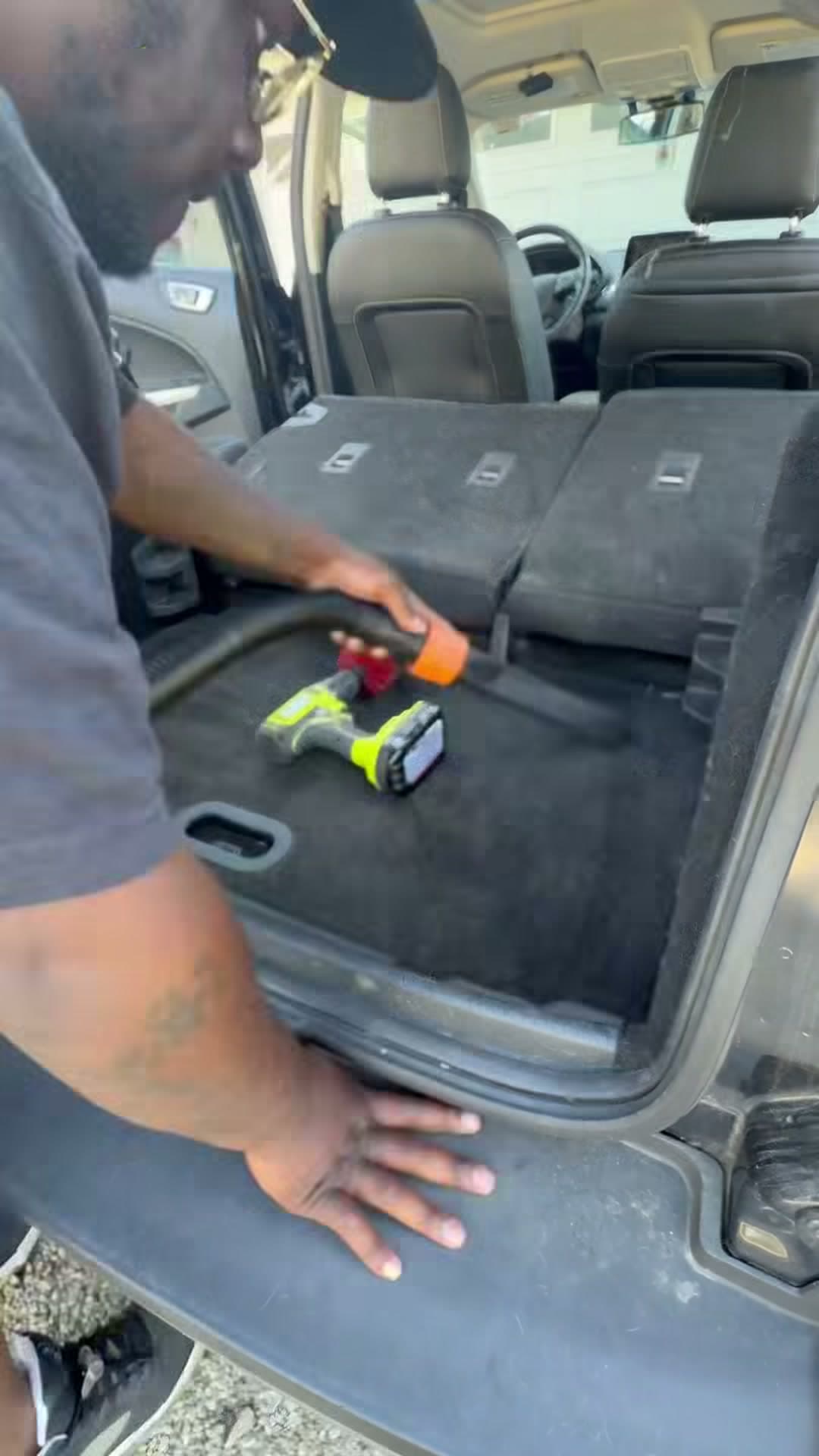 SJ's Auto Spa vacuuming the Ford Explorer cargo area