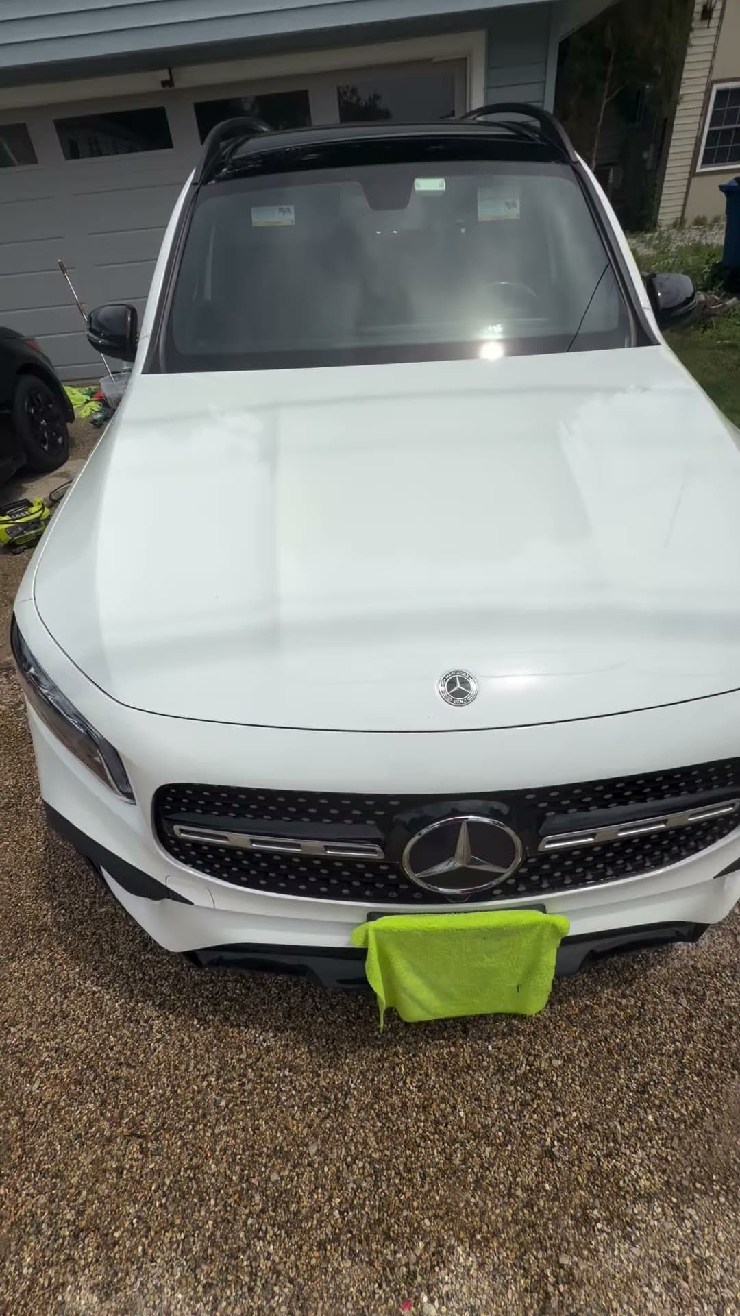White Mercedes SUV after detailing, viewed from the front